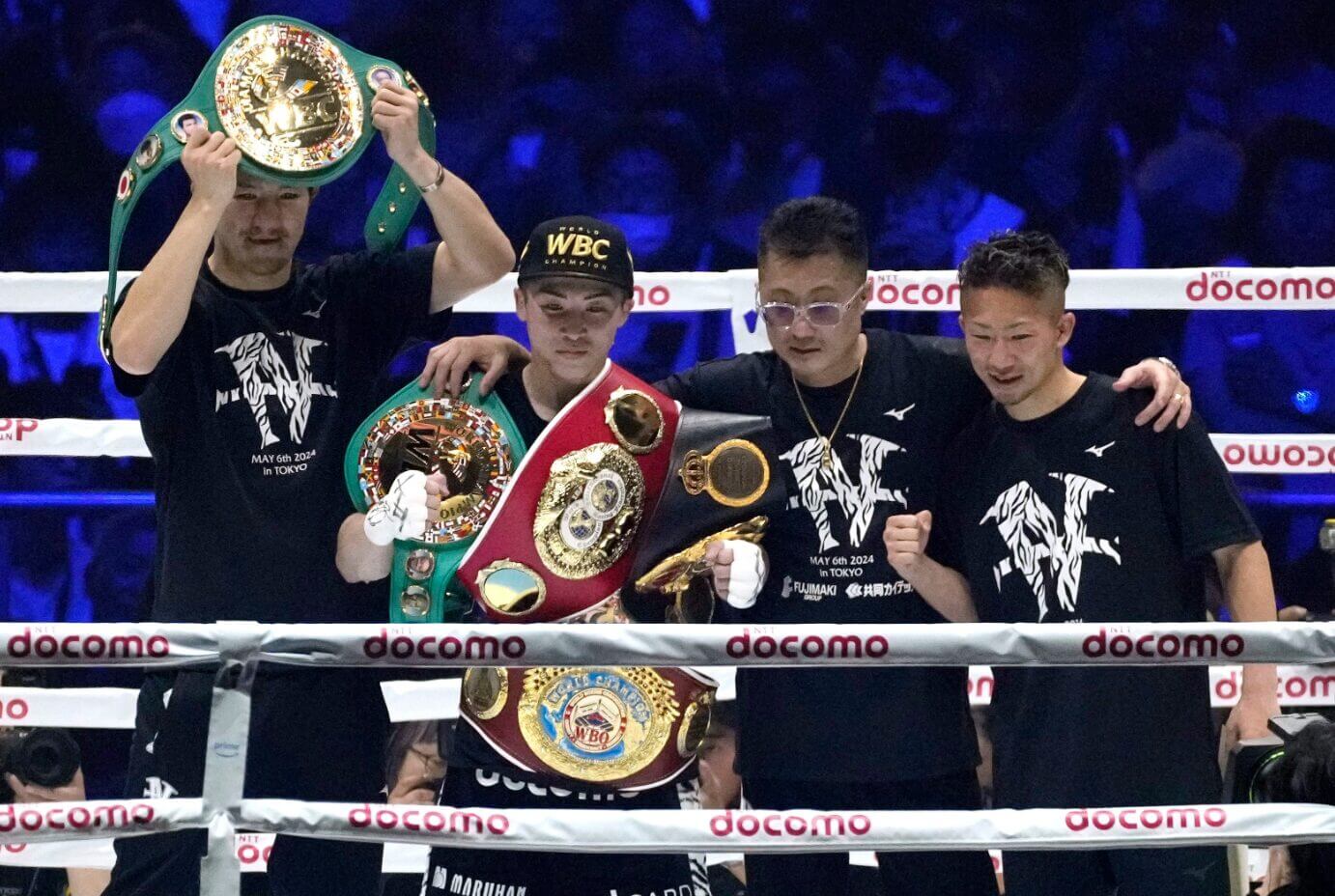 Naoya Inoue with his world titles after beating Luis Nery